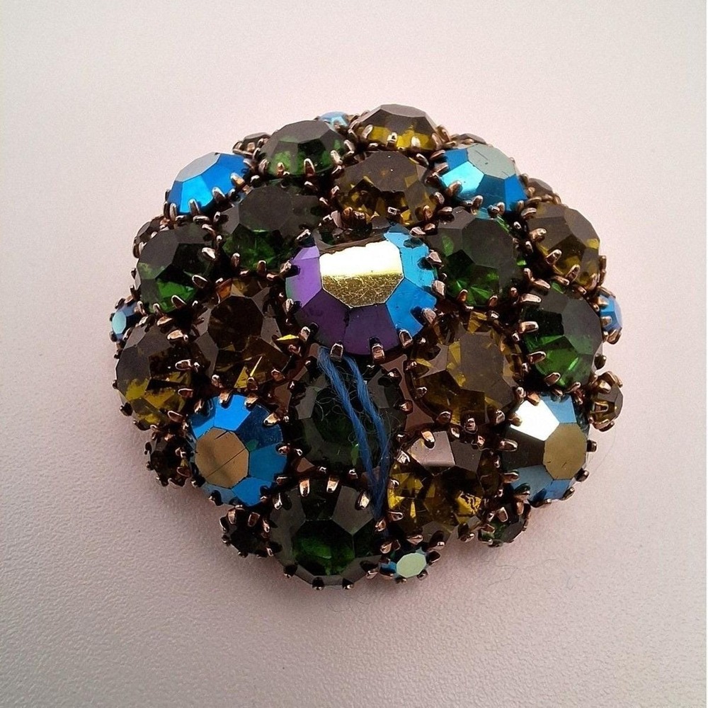 Vintage round brooch tiered AB blue rhinestones pot metal gold tone mid century